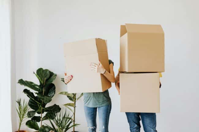 People holding moving boxes